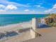 Oceanfront view showcasing a pristine sandy beach and turquoise water at 5 N Casey Key Rd, Osprey, FL 34229