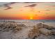 Scenic sunset over the ocean with sandy beach and rock formations at 5 N Casey Key Rd, Osprey, FL 34229