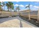 Gravel driveway with palm trees and a light-colored house at 5 N Casey Key Rd, Osprey, FL 34229