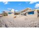 Beach house exterior showcasing a sandy beachfront and patio at 5 N Casey Key Rd, Osprey, FL 34229