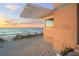 Beach house exterior with pergola and ocean sunset view at 5 N Casey Key Rd, Osprey, FL 34229