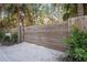 Modern wooden gate leading to a private property at 5 N Casey Key Rd, Osprey, FL 34229