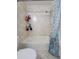 Bathroom with shower/tub combo and updated tile at 8771 Trionfo Ave, North Port, FL 34287