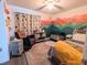 Bedroom with mountain mural, crib, and rocking chair at 8771 Trionfo Ave, North Port, FL 34287