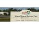 Warm Mineral Springs Park sign with address at 8771 Trionfo Ave, North Port, FL 34287