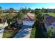 Home's exterior and surrounding landscape from above at 1342 Capri Isles Blvd # 14, Venice, FL 34292