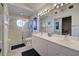 Bathroom with double vanity, shower and toilet at 1342 Capri Isles Blvd # 14, Venice, FL 34292