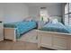 Bedroom with two twin beds, nightstands and white dressers at 1342 Capri Isles Blvd # 14, Venice, FL 34292