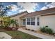 View of home's entrance with walkway and landscaping at 1342 Capri Isles Blvd # 14, Venice, FL 34292