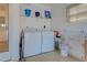 Convenient laundry room with washer, dryer, and drying rack at 1342 Capri Isles Blvd # 14, Venice, FL 34292