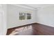 Spacious bedroom with dark hardwood floors and large window at 329 Savona Way, North Venice, FL 34275