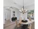 Elegant dining room features chandelier and hardwood floors at 329 Savona Way, North Venice, FL 34275