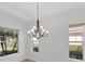 Spacious dining room with chandelier and natural light at 329 Savona Way, North Venice, FL 34275