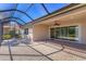 Covered patio with pavers, sliding glass doors, and a screened enclosure at 329 Savona Way, North Venice, FL 34275