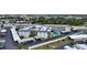 Aerial view of condo complex with pool and parking at 708 Tamiami S Trl # 308, Venice, FL 34285