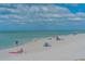 Beach with people relaxing and enjoying the day at 708 Tamiami S Trl # 308, Venice, FL 34285