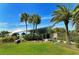 Beach pavilion with palm trees and grassy area at 708 Tamiami S Trl # 308, Venice, FL 34285