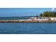 Beach scene with people enjoying the sand and water at 708 Tamiami S Trl # 308, Venice, FL 34285