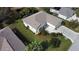 Aerial view of a single-Gathering home with a landscaped yard and driveway at 5856 Wilson Rd, Venice, FL 34293