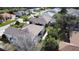 Aerial view of the house, showcasing the backyard with a screened enclosure at 5856 Wilson Rd, Venice, FL 34293