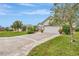 Exterior of the house, showing a white garage and well-maintained landscaping at 5856 Wilson Rd, Venice, FL 34293