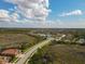 Aerial view of a residential neighborhood with lush landscape at 13587 Vancanza Dr, Venice, FL 34293