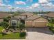 Two-story house with tile roof and two-car garage at 13587 Vancanza Dr, Venice, FL 34293