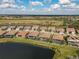 Aerial view of homes along the water, highlighting a house with a pool at 13587 Vancanza Dr, Venice, FL 34293