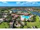 Aerial view of community amenities including pool, clubhouse, and playground at 13587 Vancanza Dr, Venice, FL 34293