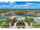 Aerial view showing community pool, tennis courts, and clubhouse at 13587 Vancanza Dr, Venice, FL 34293