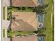 Aerial view showcasing a house with pool and backyard at 13587 Vancanza Dr, Venice, FL 34293