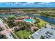 Aerial view of community amenities including pool, tennis courts, and clubhouse at 13587 Vancanza Dr, Venice, FL 34293