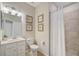 Clean bathroom with a shower, toilet, vanity, and neutral color scheme at 13587 Vancanza Dr, Venice, FL 34293