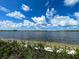 Scenic view of the lake and blue sky at 13587 Vancanza Dr, Venice, FL 34293