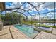 Enclosed pool and spa area with a lake view at 13587 Vancanza Dr, Venice, FL 34293