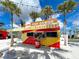 Pop Dawgs food stand in a vibrant shipping container at 13587 Vancanza Dr, Venice, FL 34293