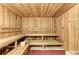 Relaxing sauna with wooden benches and walls at 13587 Vancanza Dr, Venice, FL 34293