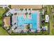 Aerial view of the community pool featuring a lap pool, recreational pool, and ample lounge seating at 19256 Lappacio St, Venice, FL 34293