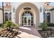 IslandWalk event center entrance features a grand archway and inviting landscaping at 19256 Lappacio St, Venice, FL 34293