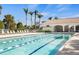 Resort-style pool with lounge chairs and a poolside building at 19256 Lappacio St, Venice, FL 34293