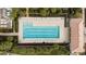 Relaxing community pool with ample lounge chairs at 19256 Lappacio St, Venice, FL 34293