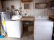 Functional laundry room with washer, dryer, and utility sink at 359 Longwood Dr, Venice, FL 34285