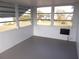 Enclosed sunroom offering view of the backyard at 359 Longwood Dr, Venice, FL 34285