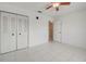 Bedroom features tile floors, a ceiling fan, and closet at 766 Avenida Estancia # 196, Venice, FL 34292