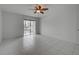 Spacious bedroom with sliding glass doors leading to a balcony and tile floors at 766 Avenida Estancia # 196, Venice, FL 34292