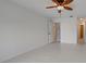 Bright bedroom featuring tile floors, fresh paint, and an ensuite bathroom with modern fixtures at 766 Avenida Estancia # 196, Venice, FL 34292