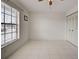 Bedroom featuring tiled floors, closet, and a window view at 766 Avenida Estancia # 196, Venice, FL 34292