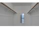 Empty closet with wood racks; attached to the main bathroom at 766 Avenida Estancia # 196, Venice, FL 34292