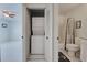 Bathroom closet with in-unit stackable washer and dryer and shared access to the toilet and tub at 766 Avenida Estancia # 196, Venice, FL 34292
