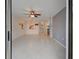 Spacious living area featuring tile flooring and access to the kitchen, providing a comfortable and connected space at 766 Avenida Estancia # 196, Venice, FL 34292